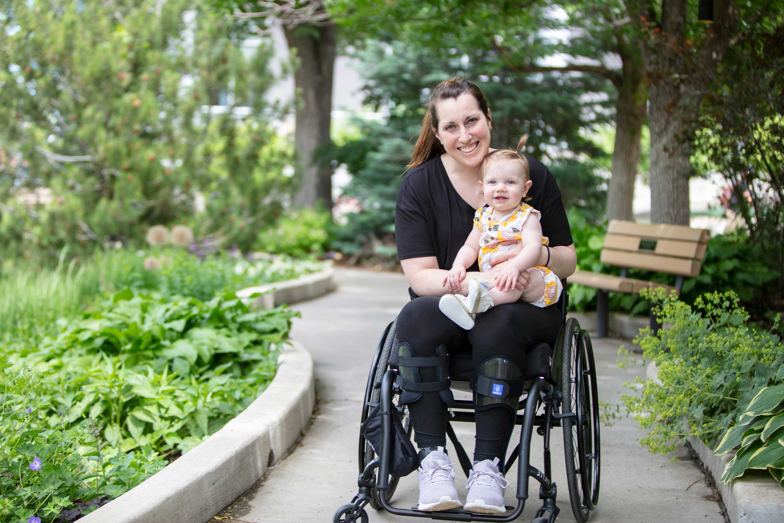 Patient with a child in Craig hospital gardens