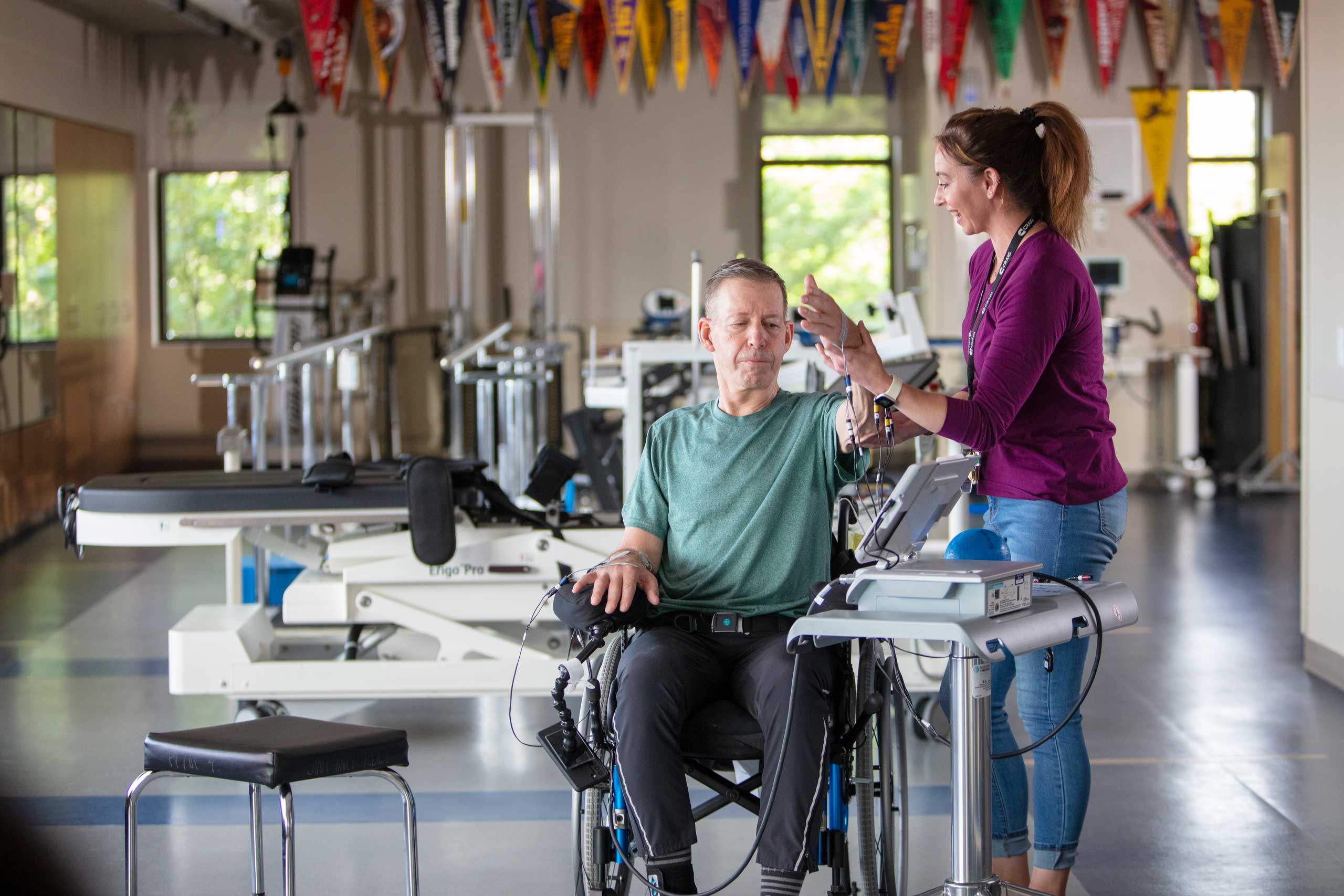 Phsical Therapist assisting a patient in an excercise