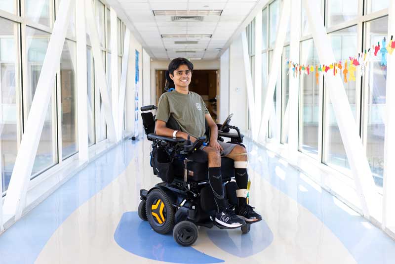patient in a wheelchair in a hospital bridge