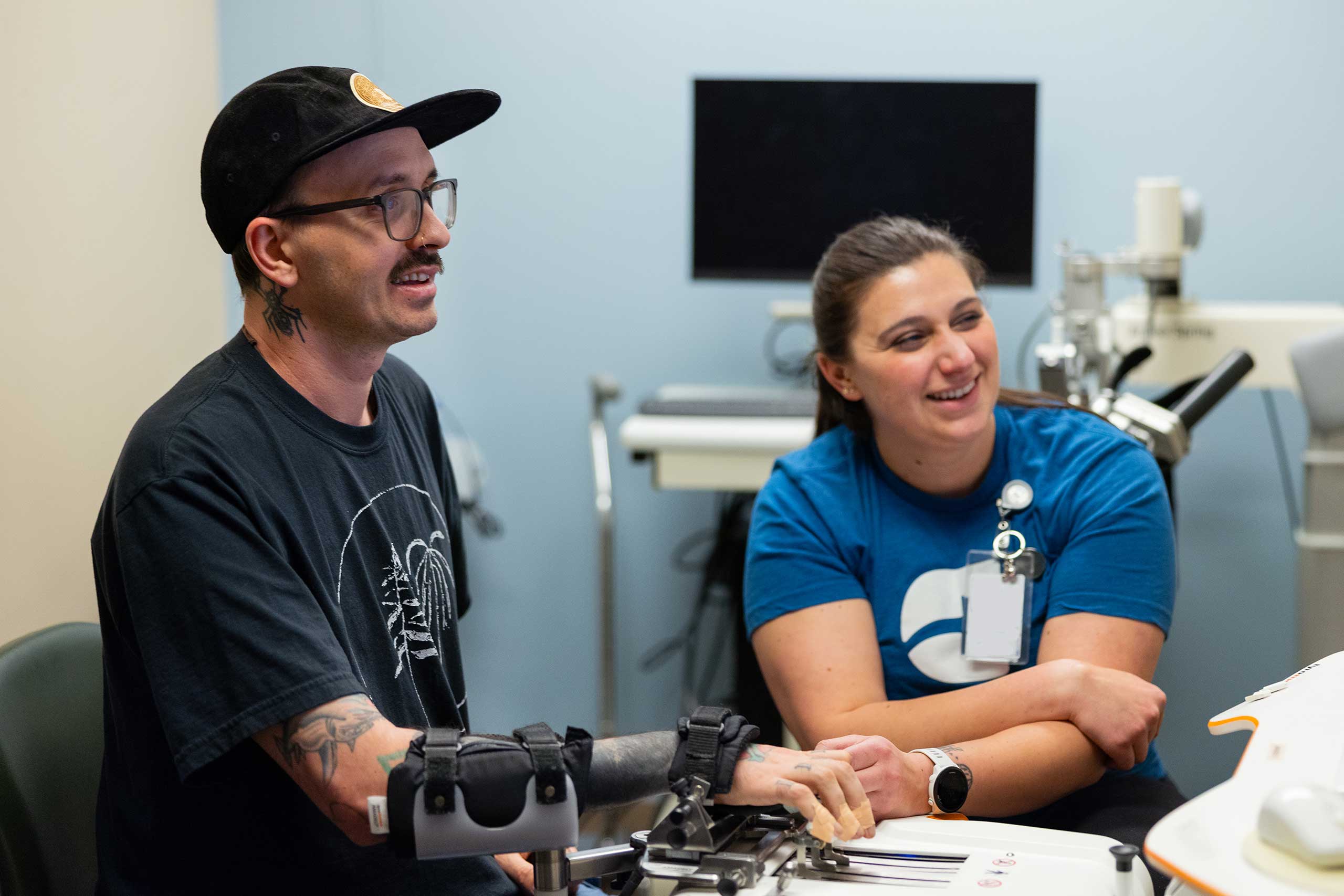 physical therapist teaching a patient how to use tools